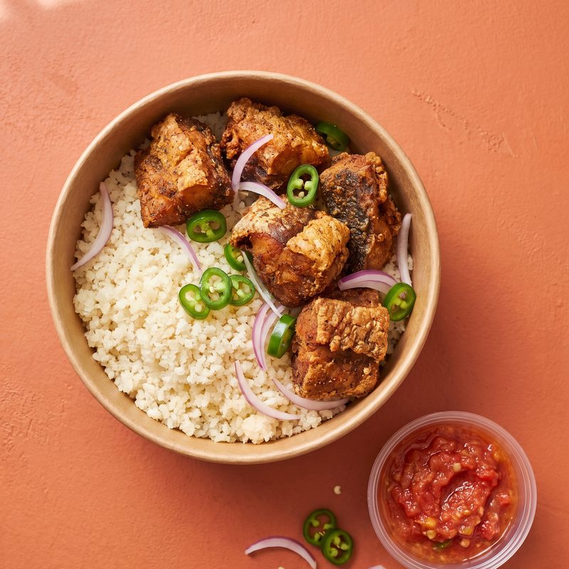 Garba: attiéké topped with crispy fried fish, green chili and a tomato-onion relish